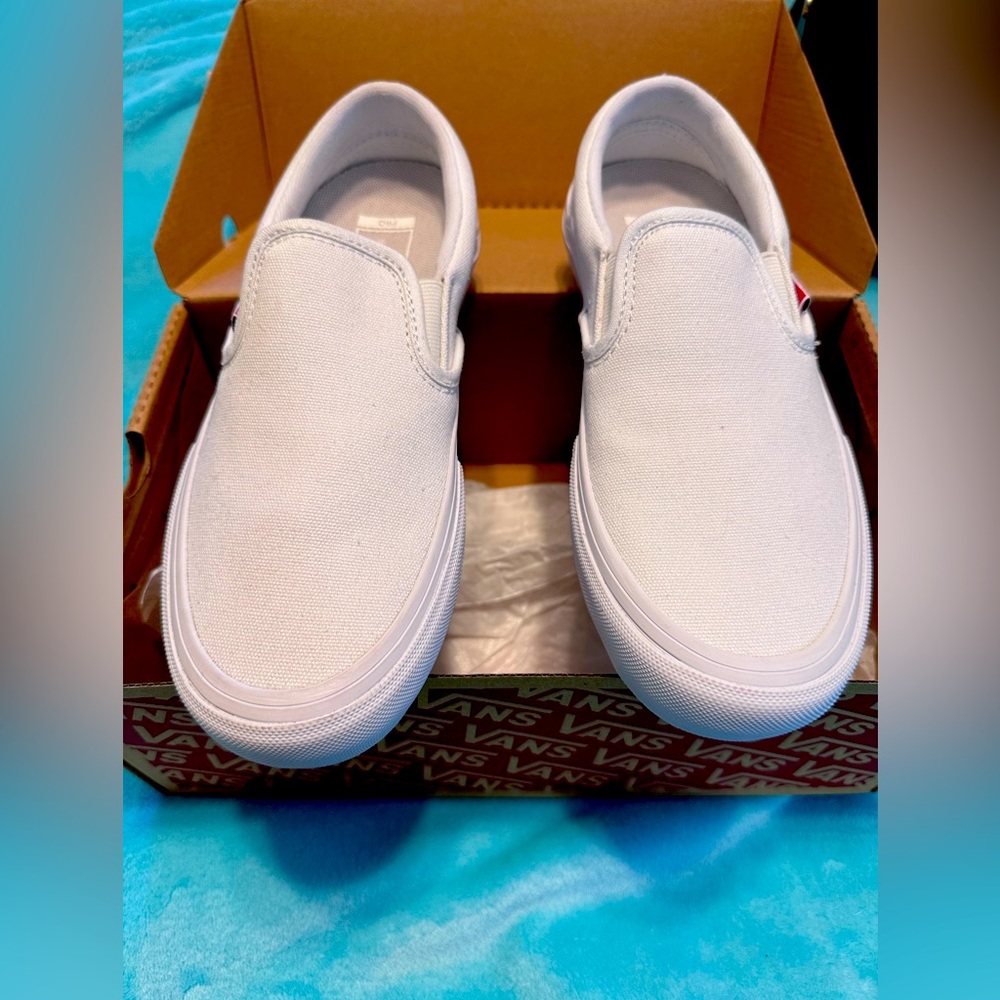 White slip on Vans